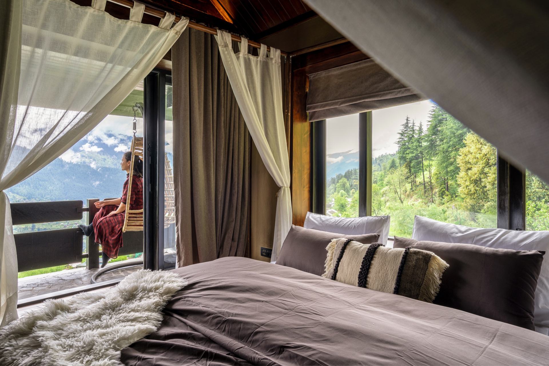 Canopy bed suite with mountain-facing windows at Ark Hunzuru
