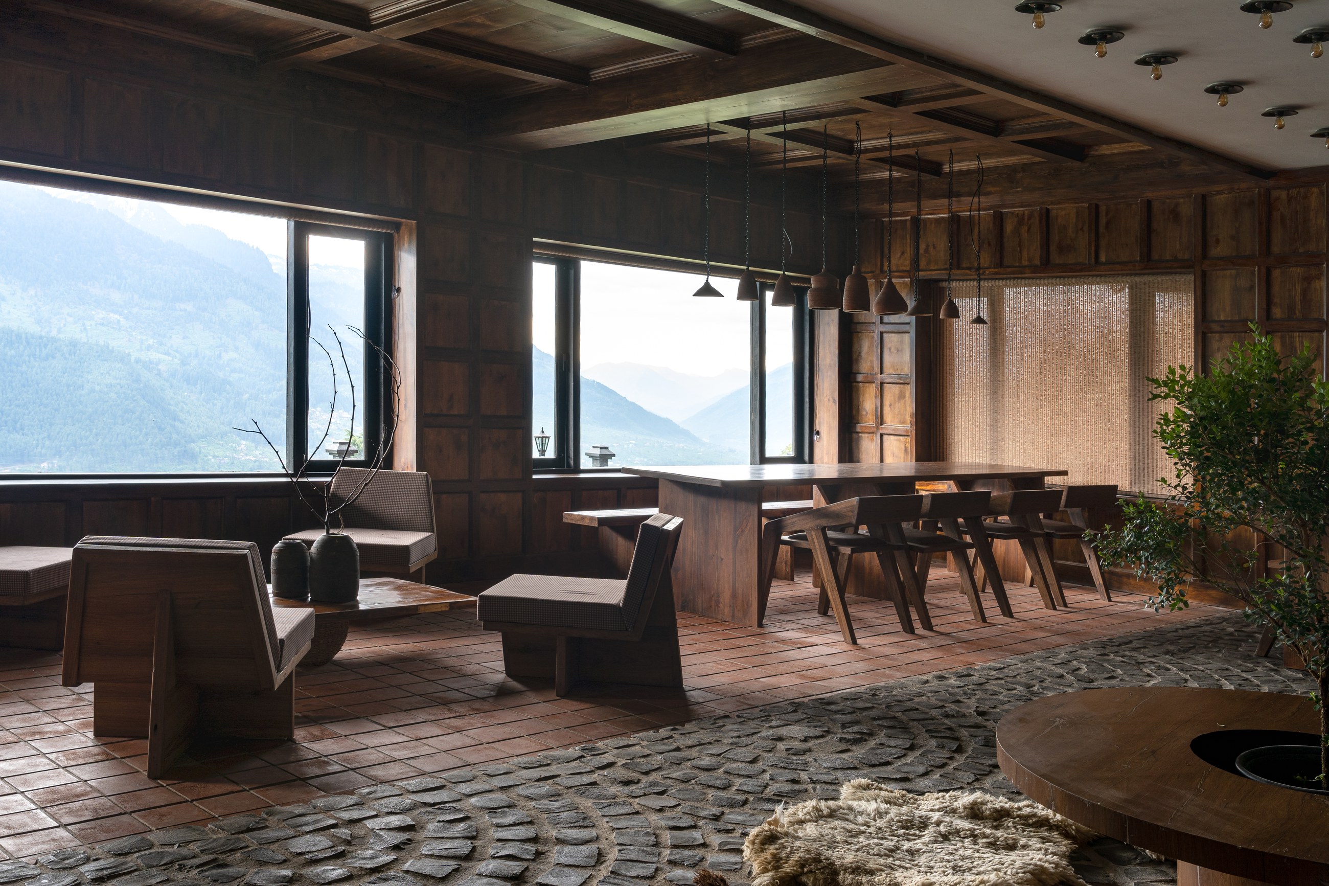 Lounge and dining room at Ark Hunzuru with mountain-view windows