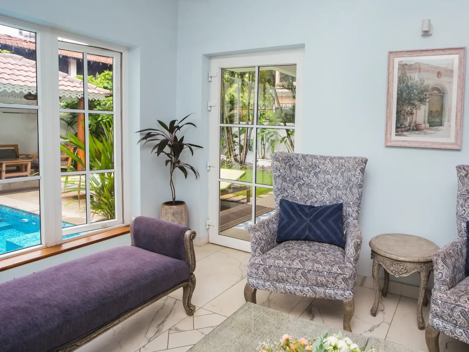 Sitting area with pool-view windows