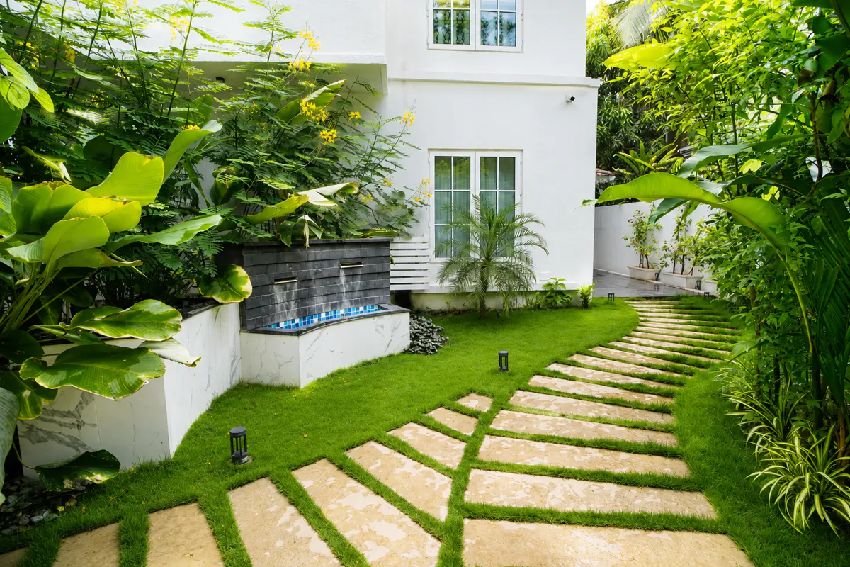 Stepping-stone path winding through the villa garden