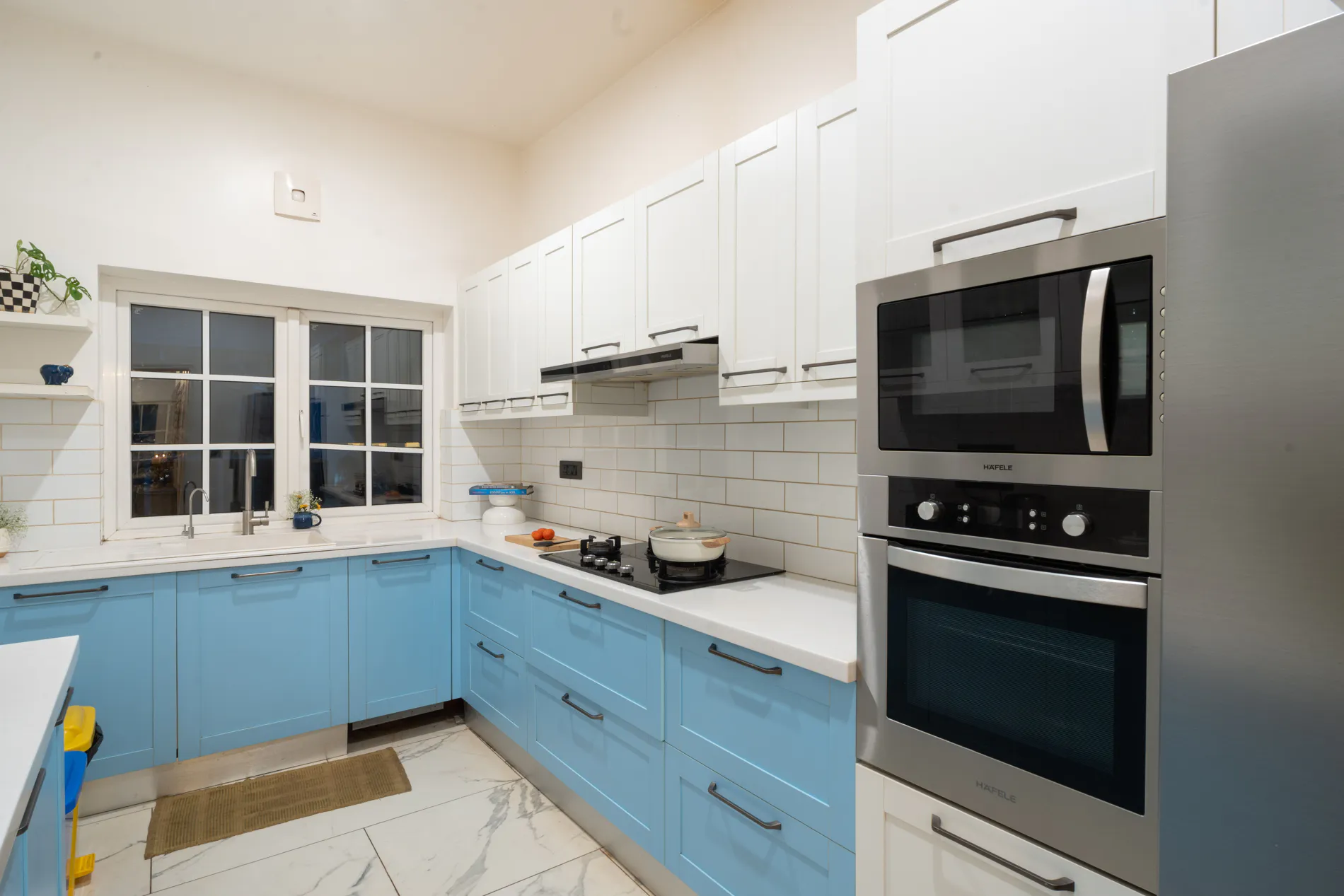 Modern kitchen with pale blue cabinets